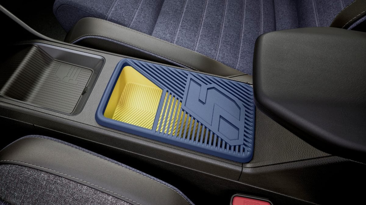 Consolle centrale della Renault 5 E-Tech Electric con il vano per lo smartphone